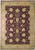 Full overhead view of wine red Chobi rug with gold palmettes and wide wheat brown border