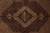 Close view of the scalloped medallion and the dense Herati lattice filling the dark field