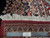 Reverse of the rug with ruler and Authentic Handmade label beside the knotted border