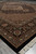 Angled corner view on grey tile, border leaves and brown field receding toward the medallion