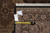 Back of the rug with dealer tag reading F-3060 and a tape measure across the border