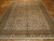 Full view of the 6'8" x 9'6" Sivas rug laid flat on parquet, fringe toward camera