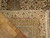 Back of the rug folded over, showing even hand-knotting, pattern on the reverse and ivory fringe