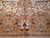 Close view of the border cartouche, flame bud motif and rose-ground quatrefoil guard stripe
