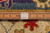 Back of the rug with a ruler and handmade label showing even knot rows