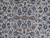 Close view of the field: blue rosettes, palmettes and brown leaves on scrolling ivory vinework