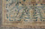 Corner detail of the celadon main border with mirrored palmettes, guard stripes and cream fringe