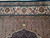 Close view of the border bands meeting the light herati field and the top pendant cartouche