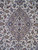 Close view of the lobed taupe centre medallion with rosettes, pendants and surrounding ivory field vines