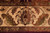 Straight-on detail of the ivory main border, leafy palmette and both guard stripes