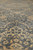 9x12 Chobi rug surface at floor level, peach palmettes rising from the grey tiled field
