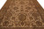 Close perspective of beige field filled with palmettes, acanthus leaves and olive green rosettes