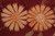 Two large orange daisies side by side showing wool and silk color shading and tone
