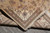 Rug folded back to show tight knotting and the matching ivory border on the reverse