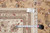 Back tag reading F-4159 8.6 x 11.6 beside a tape measure on the rug edge