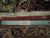 Reverse side with ruler and Authentic Handmade tag showing cotton warps and ivory fringe