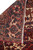 Reverse fold revealing hand-knotted wool pile, cotton foundation rows and original ivory fringe edge