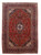 8'2" x 11'8" Persian Kashan rug with red field, navy border and ivory corner spandrels