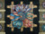 Central Art Deco ribbon medallion framed by tan lattice bars on black hand-knotted wool pile