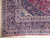 Corner detail of navy spandrel with five floral border bands and ivory guard stripes