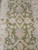 Ziegler all over pattern close-up with pale blue accents, ivory blossoms and red flower heads