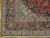 Corner detail showing navy main border, pale blue guard stripes, ivory outline and clean cotton fringe