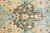 Detail of the all over floral palmette motif in charcoal, olive, apricot and light blue