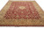 Wide perspective of the large wool area rug, wine red ground framed by honey gold border