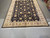 Indian Zigler rug photographed from one end with hand-tied fringe in the foreground