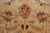 Detailed central palmette with sage leaves and burgundy accents woven in fine natural wool