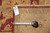Back tag reading 804-91 with tape measure confirming the 8'10" x 11'10" rug size