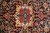 Close-up of the ivory and sky blue 8 lobed medallion against the dark navy floral field