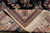 Folded corner revealing dense wool pile, ivory border palmettes and hand-tied cream cotton fringe