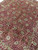 9x12 Indian wool rug seen from above with all over Ziglar floral design in rust