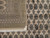 Folded corner beside the field showing border panels, fringe and inventory tag marked 6845, 9x11.6