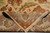 Folded corner showing cotton foundation, even hand-knotted wool pile and natural ivory fringe ends