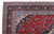 Corner detail showing navy main border, pale blue vine guards and ivory cotton fringe