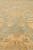 Close view of light green field with gold rosettes, scrolling vines and gentle abrash