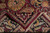Folded corner revealing cotton foundation and hand-knotted back of this 9x12 Jaipur wool rug
