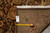 Back of rug with inventory tag F-4489 and tape measure confirming 9'1" x 12'3" size