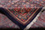 Folded back corner revealing the reverse, knot density and the cotton foundation behind the pile