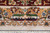 Woven cartouche signature panel in the gold border above ivory fringe and blue weft stripes