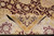 Folded corner showing even wool pile depth, gold guard border and burgundy palmette drawing