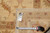 Back tag marked F-4173 size 9 x 12 beside a tape measure on the rug