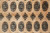 Detail of octagonal guls quartered in black, peach, sage green and ivory hand-knotted wool