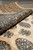Rolled edge of the 9x12 Bokhara rug showing dense weave and thick wool pile