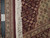 Ruler and authentic hand-knotted tag beside cotton fringe showing fine wool and silk pile