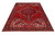7x10 Persian Heriz rug viewed at an angle, stepped medallion and ivory corner spandrels visible