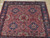 Square Sarouk rug for a sitting room, dense floral drawing in red, navy and ivory