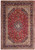 Full view of 9'7" x 10'8" Persian Kashan rug with red floral field and navy medallion